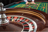 A view of Roulette and piles of gambling chips on a table in a casino