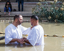 Two pilgrims make an oath during the ceremony of baptism