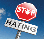 Two signs saying stop hating