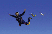 A parachutist soaring in the sky