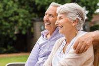 Senior couple sitting together on bench at park!