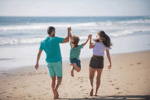 Happy family walk on sea sand beach.