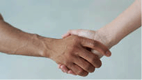 White and black hands connect.