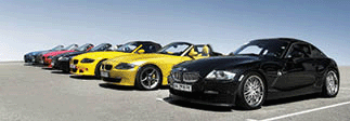 Row of BMW Z4 cars on the background of clear sky.