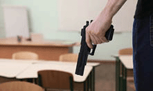 Man with a gun in classroom.