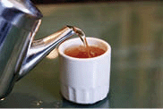 Hot Tea being poured into a cup