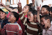 Tibetan children singing in Choglamsar, India.
