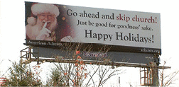 A billboard reads Go ahead and skip church! Just be good for goodness' sake. Happy Holiday!