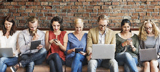 A picture of a diverse group of people using digital devices to make social connections.
